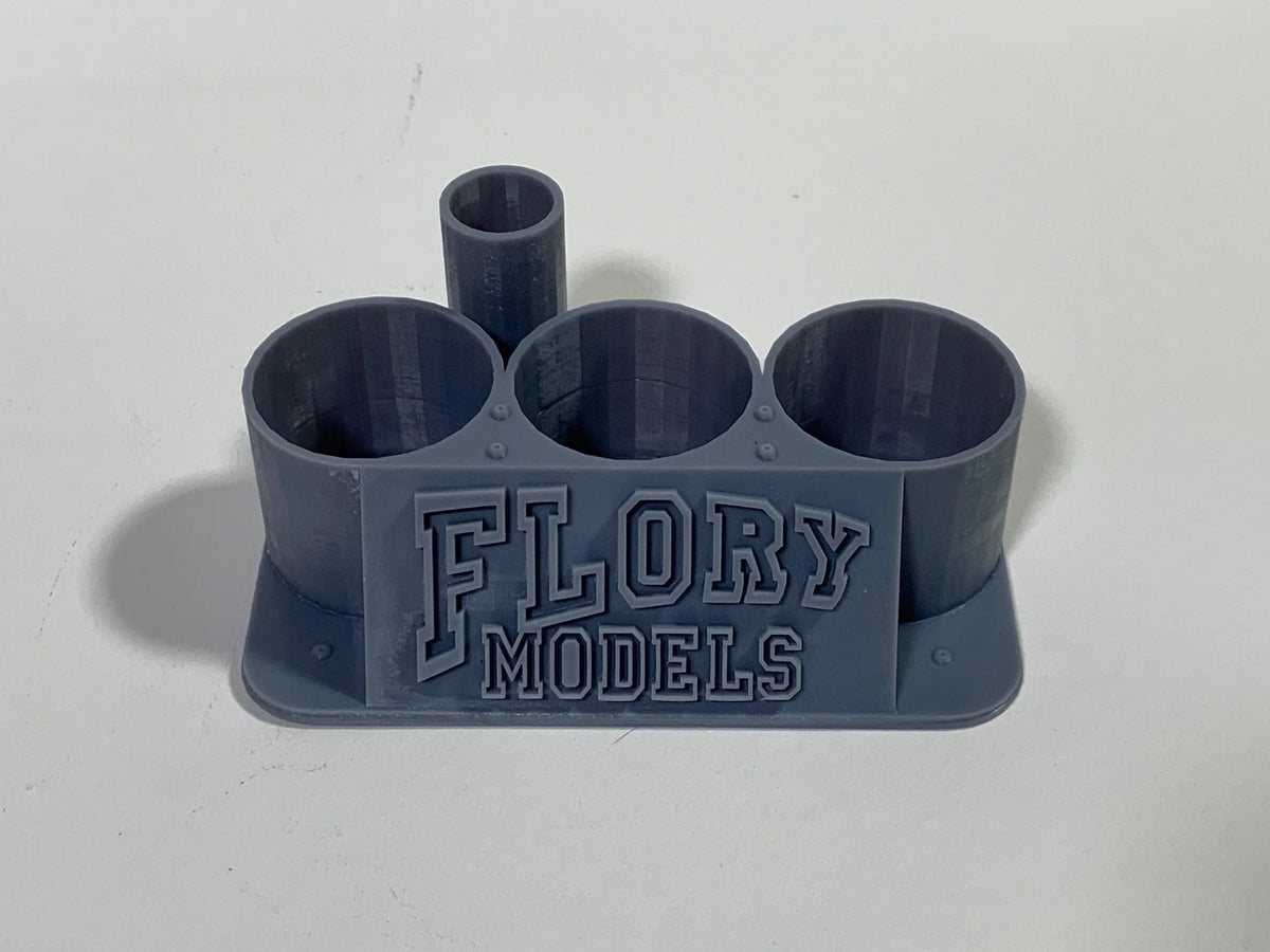 Flory Models 3D Printer Micro 3 Pot Holder holding three Micro Set and Micro Sol sized bottles on a scale modelling workbench.