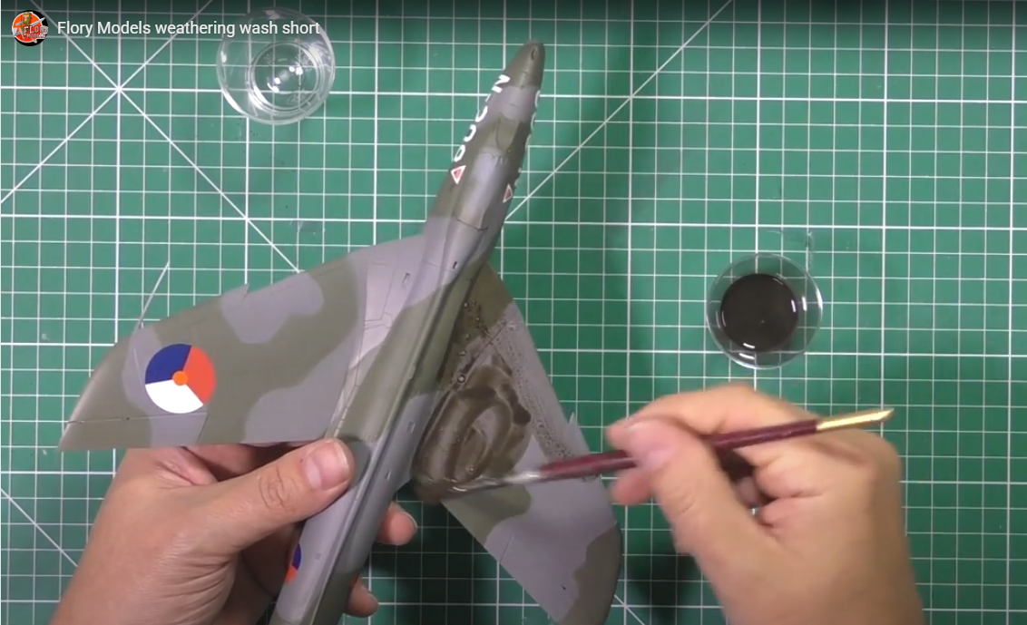 Flory wash being applied to a scale model aircraft 